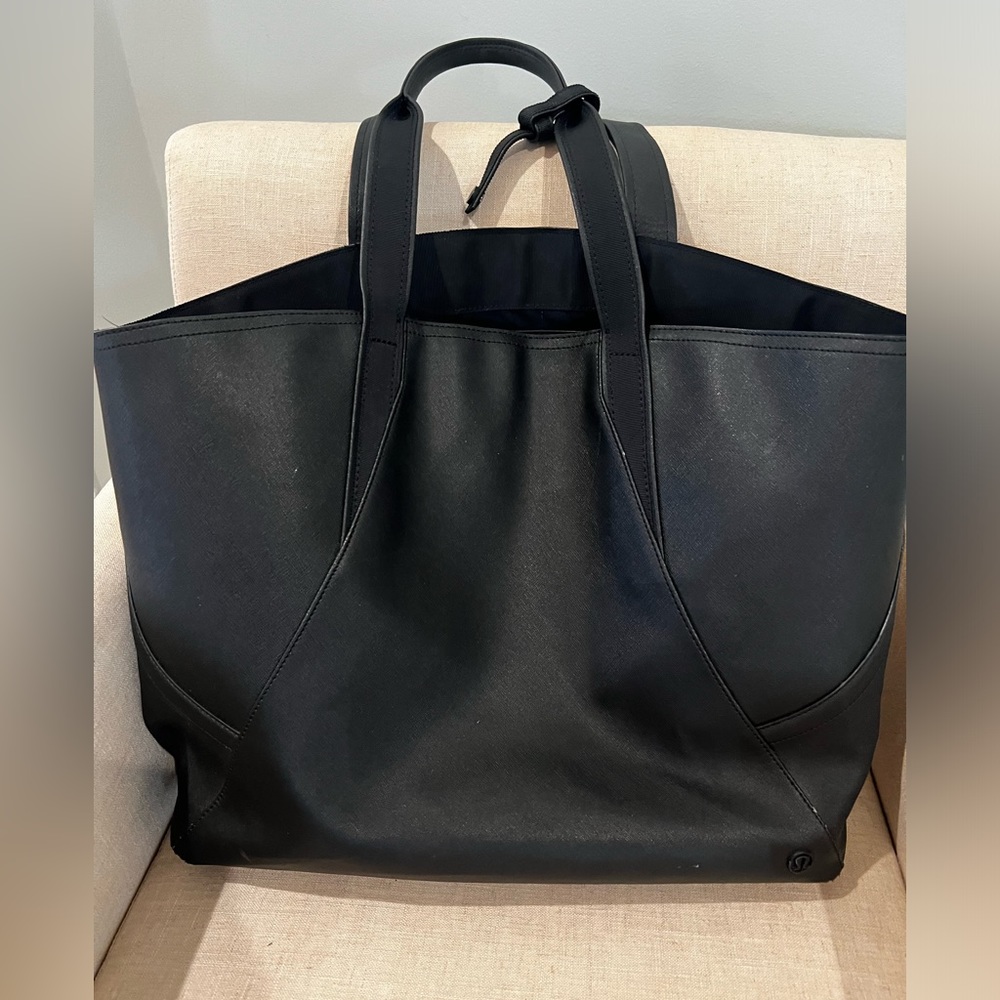 Lululemon Black Tote. 18.5” wide x 13” long. 2 Zippered inner  pockets.